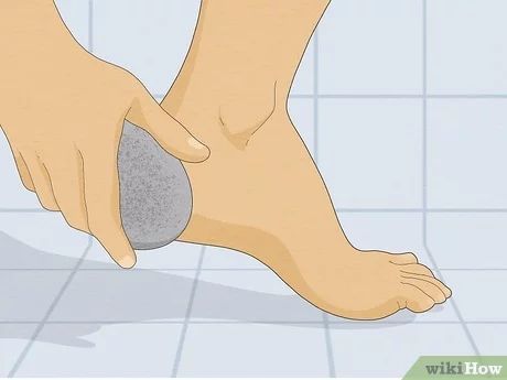 How to Get Soft Feet: 10 Steps (with Pictures) - wikiHow Life Excess Skin, Foot Scrub, Cuticle Remover, Petroleum Jelly, Pumice Stone, Wild Orange, Foot Cream, Vitamin E Oil, Epsom Salt