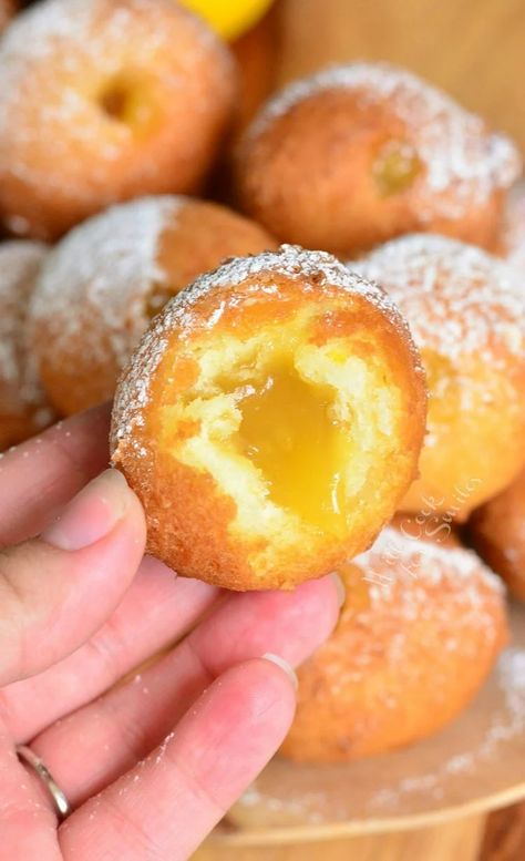 holding Lemon Curd Filled Doughnut with a bite out of it and the rest of the donuts in the background Donut Hole Recipe, Doughnut Recipe Easy, Homemade Donuts Recipe, Doughnut Holes, Sweet Breakfast Treats, Lemon Curd Filling, Nice Recipes, Filled Donuts, Homemade Donuts