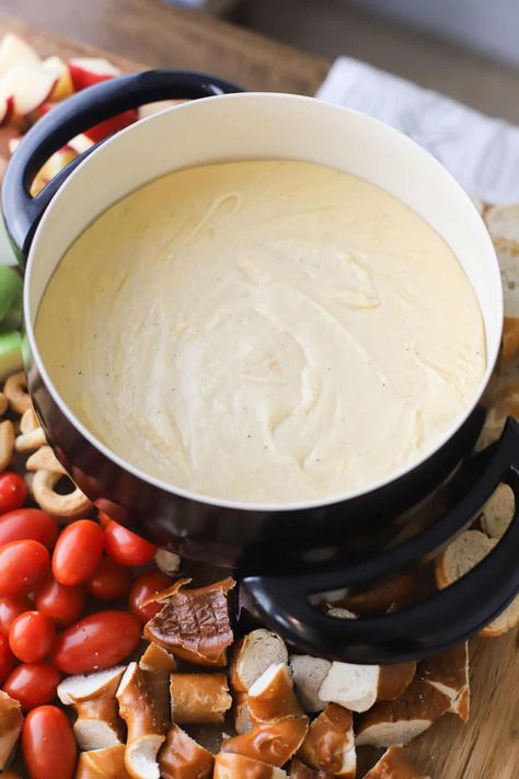 This Easy Cheese Fondue recipe with white wine is a great appetizer to enjoy at home for Valentine’s Day, game day, New Years Eve, or cozy date nights. You only need a few ingredients to make the most silky, smooth, delicious cheese fondue. #thecarefreekitchen #cheese #fondue #cheesefondue #appetizer #valentinesday #datenight #snacks Vegetarian Fondue Recipes, Cheese Fondue With Wine, Cougar Gold Cheese Recipes, Simple Cheese Fondue Recipe, Easy Cheese Fondue Recipes 3 Ingredients, Easy Fondue Recipes 3 Ingredients, Best Cheese Fondue Recipe, Fondue Recipes Easy, Cheese Fountain Recipe