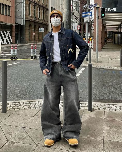 How about his color? 🛰️ 📸 @jira.exe 🇩🇪 🧢Hat : carhartt 👔Top : evisu 👖Bottom : trendtvision 👞Shoes : timberland Unlock the style with an “Evisu” deep blue denim printed jacket, layered over a white inner shirt for a classic touch. Paired with “Trendtvision” baggy gray jeans, the shirt is neatly tucked in for a polished look. Complete the ensemble with “Timberland” boots and top it off with a “Carhartt” yellow beanie for a pop of color. This outfit effortlessly blends streetwear vibes w... Deep Blue Jeans Outfit Men, Dark Blue Denim Jacket Outfit Men, Outfit Ideas With Jean Jacket, Dark Blue Denim Jacket Outfit, Evisu Jeans Outfit, Outfit With Beanie, Gray Jeans Outfit, Blue Denim Outfit, Mens Cardigan Outfit