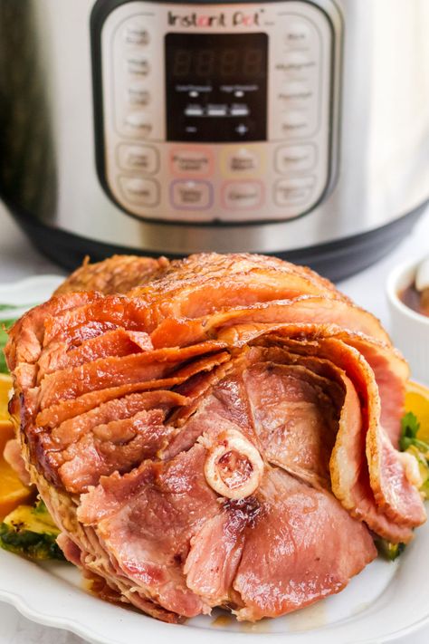 Instant Pot Ham is a fool-proof recipe that'll make holiday entertaining a breeze! Ready in 50 minutes, this will become your go-to recipe! #BreadBoozeBacon #instantpot #ham #glazedham #pineapple #brownsugar #honey #easter #christmas Ham In An Instant Pot, Ham Instant Pot Recipes Precooked, Easter Ham Instant Pot, Spiral Ham In Instant Pot, Honey Glazed Ham Instant Pot, Instant Pot Ham Recipe, Pressure Cooker Ham, Spiral Cut Ham, Spiral Sliced Ham