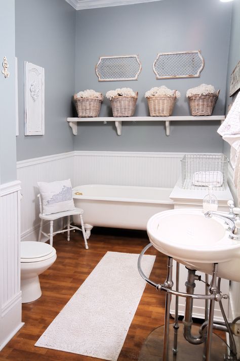 Beautiful farmhouse bathroom renovation @Deb Keller Farm . Love the diy shelving! Bathroom Paint, Gray Bathroom, Beach Theme Bathroom, Perfect Paint Color, Blue Paint Colors, Classic Gray, Wooden Floors, Interior Paint Colors, Beach Bathrooms