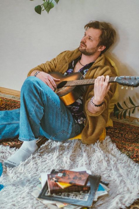 A man sitting on a rug playing an acoustic guitar · Free Stock Photo Man Playing Guitar, Man Sitting, Playing Guitar, Acoustic Guitar, Free Stock Photos, Guitar, Stock Photos