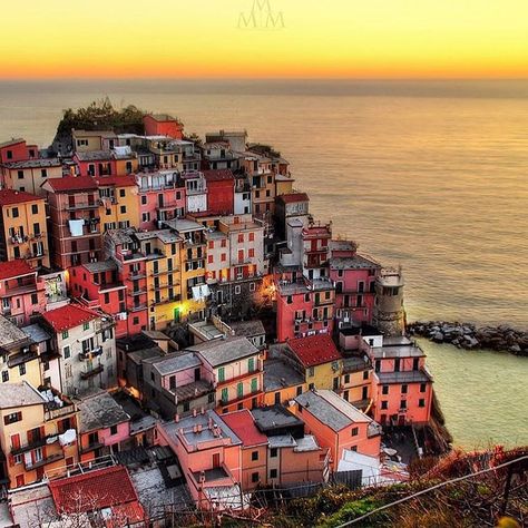 Manarola, Cinque Terre, Italy 🇮🇹 This captivating image showcases the colorful cliffside village of Manarola, one of the five towns that make up Cinque Terre in Italy. The pastel-hued buildings are tightly packed on a rugged promontory overlooking the Ligurian Sea, bathed in the warm glow of a stunning sunset. The serene ocean and the vibrant village combine to create a quintessential Mediterranean scene, reflecting the timeless beauty of Italy’s coastal gems. Mediterranean Cities, Cliffside Village, Manarola Cinque Terre Italy, House Flipper, House Flippers, Stunning Sunset, Cinque Terre Italy, Timeless Beauty, Travel Destinations