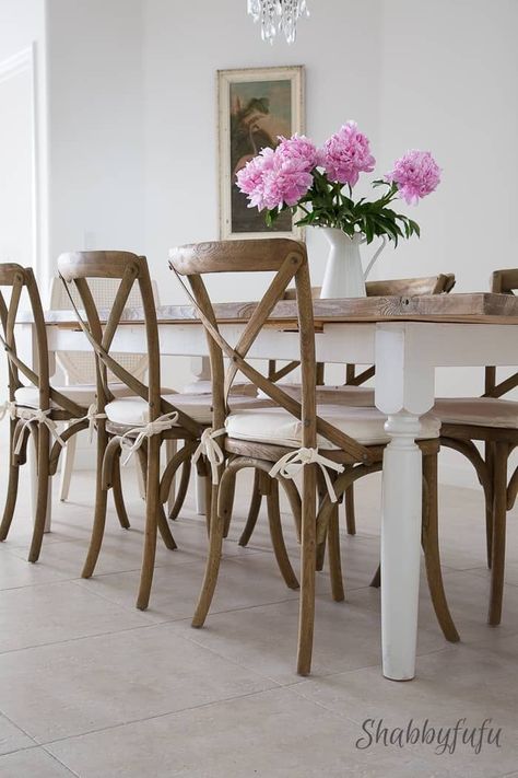 Do you love the look of weathered farmhouse tables and have a few DIY skills? We will show you exactly how to make this farmhouse table with a full tutorial loaded with visuals to help you along the way! We even give instructions on a driftwood finish plank top! #farmhouse #farmhousestyle #farmhousetable #limewash #whitewash #diytables #tablebuild #farmhousefurniture #modernfarmhouse #restorationhack #shabbyfufu Wood Top White Legs Table, Dining Table Chairs Farmhouse, White Farmhouse Chairs, Dining Table White Legs Wood Top, Farmhouse Table With Chairs, White Table Wood Chairs, Wood Chair With Cushion, Farmhouse Chair Cushions, Chairs For Farmhouse Table