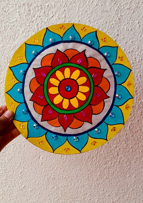 Mandala artwork with paint🎨🖌️ Drawing On Cardboard Artworks, Rangoli Painting On Canvas, Easy Round Rangoli Design, Rangoli Mandala Designs, Paper Plate Decoration Ideas, Cd Mandala Art, Wall Plates Decor Diy, Rangoli With Paint, Rangoli Designs On Paper