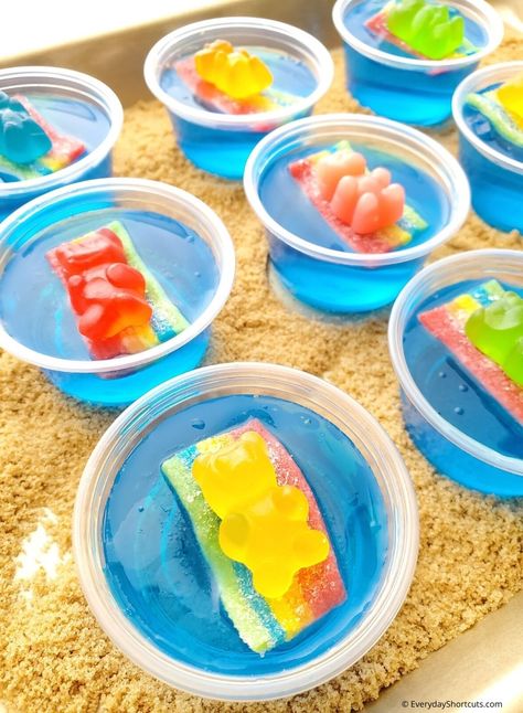 Beach Party Jello Shots - Everyday Shortcuts Tiki Jello Shots, Pool Jello Shots, Gummy Bear Jello Shots, Fun Pool Party Food, Shotcuterie Board, Beach Jello Shots, Pool Party Jello Shots, Fun Jello Shots, Party Jello Shots