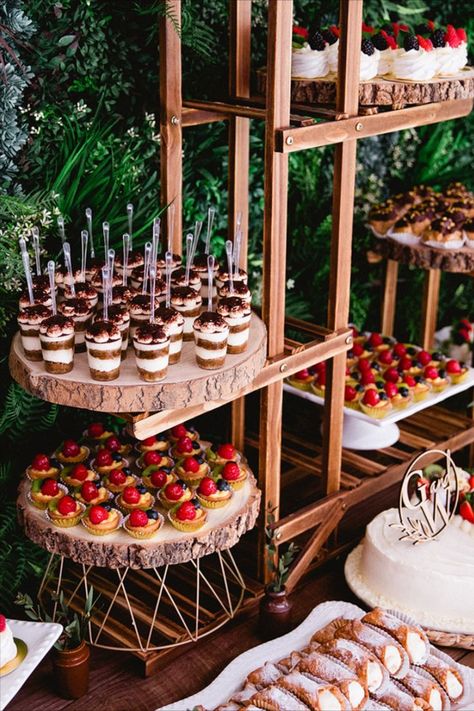 Wedding Dessert Table Ideas Plant Stand Dessert Table, Food Corner Wedding, Autumn Wedding Menu Food Ideas, 2023 Wedding Dessert Trends, Grab And Go Desserts Wedding, Rustic Wedding Dinner Table, Unique Wedding Dessert Table, Boho Fall Wedding Dessert Table, Dessert Display Ideas Restaurant