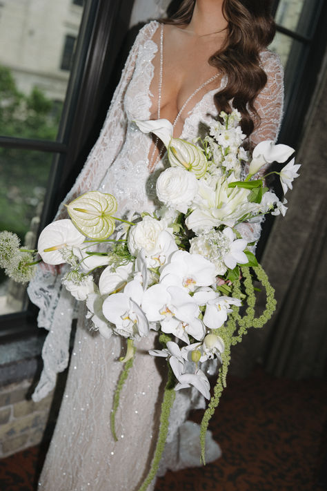 Enhance your wedding with the timeless elegance of a white orchid bridal bouquet. Delicate and sophisticated, white orchids symbolize beauty, luxury, and charm, making them perfect for your special day. Explore more floral inspiration and wedding ideas on our website and follow us on Pinterest for stunning bridal bouquets and decor. Wedding Florals Orchids, Orchid And Palm Bouquet, Rose And Orchid Bridal Bouquet, Waterfall Orchid Bouquet, Orchid And Hydrangea Bouquet, Cascading Orchid Wedding Bouquet, Wedding Bouquets With Orchids, Wedding Bouquet Orchids, Structured Bouquet