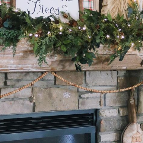 Sarah Harmsen 🌳SUGARMAPLEnotes on Instagram: "My absolute favorite decorating trick is to use wrapping paper to transform my fireplace art piece each holiday. It makes such a big impact! I always choose something different each Christmas, but this might be my favorite year yet! Another trick is to use your kid’s play blocks to raise up a smaller layering art piece in front. Then add a Christmas garland. I secure mine with good old fashioned nails. That’s the benefit of having a 100 year old barn beam as a mantle - it can hide a couple nail holes! Adds more character :) Do you think you’ll use wrapping paper to transform any of your current wall art this year? 🎄 #christmastips #christmasmantle #christmaslivingroom #christmasdecor #christmastime #christmastips #christmasdecorating #chr Layering Art, Fireplace Art, Layered Art, Christmas Mantle, Christmas Living Rooms, Nail Holes, Old Barn, Christmas Garland, Good Old