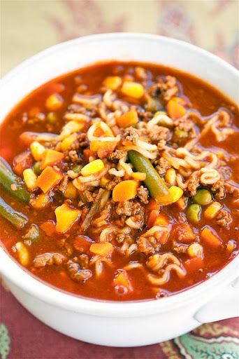 Try xxxBeef and Ramen Vegetable Soup! You'll just need 1 lb lean ground beef, 1 (46-oz) bottle V-8 Vegetable Juice, 1 (1.35-oz) package onion soup mix, 1... Beef And Ramen, Beef Ramen Noodles, Hamburger Vegetable Soup, Beef Ramen, Beef Soup Recipes, Ramen Noodle Recipes, Vegetable Beef Soup, Ramen Soup, Ramen Recipes