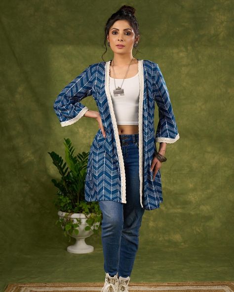 Elevate your wardrobe with our Boho Chic Indigo Blue Shrug. Featuring a vibrant print and whimsical laces, this piece will add a touch of bohemian flair to any outfit. Made with high quality materials, this shrug is both stylish and comfortable. Perfect for those looking for a unique and trendy piece to complete their look. #sujatra #sujatraglobal #sujatrajackets #bohochic #indigoblue #cottonshrugs #longshrug #cottonjacket #lace Blue Shrug, Long Shrug, Cotton Jacket, Indigo Blue, Boho Chic, Wardrobe, Lace, High Quality, Blue