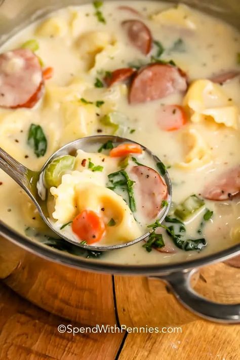 Tasty and creamy, tortellini soup is the best with sausage, spinach, and broth. Perfect for dunking and dipping, this soup loves garlic bread! #spendwithpennies #creamytortellinisoup #maindish #recipe #crockpot #instantpot #stovetop #sausage #spinach #easy #slowcooker Bacon Wrapped Meatloaf, Creamy Tortellini, Creamy Tortellini Soup, Sausage Tortellini Soup, Sausage Spinach, Recipe Crockpot, Spend With Pennies, Sausage Soup, Beef Stir Fry