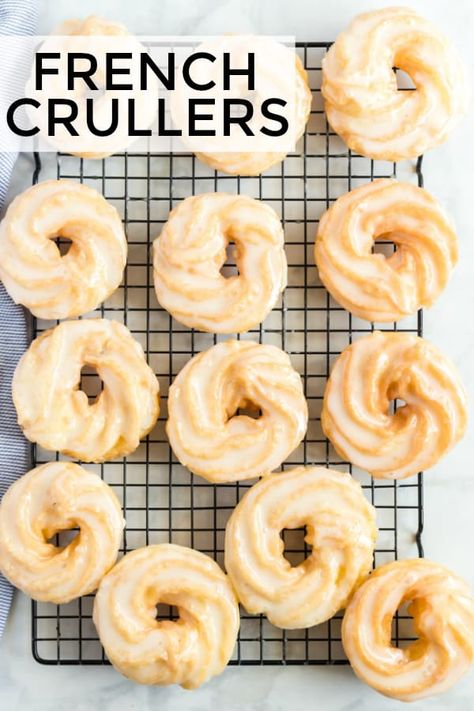 Crispy, sweet and absolutely delicious these French Crullers are the perfect breakfast recipe that will satisfy your sweet tooth with minimal ingredients. #breakfast #donuts #crullers #recipe #deepfried #doughnuts #pastry Baked French Cruller Recipe, How To Make French Crullers, Baked Cruller Donut Recipe, French Curler Donut Recipe, Crawler Donut Recipe, French Crawler Donut Recipe, Nutty Donuts Recipe, French Cruller Donut Recipe, French Donuts Beignets