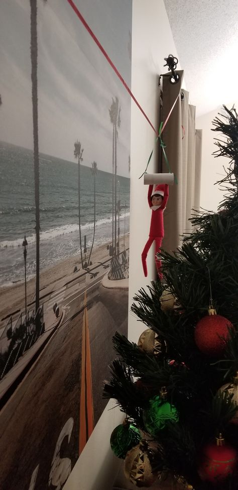 Zipline Elf On The Shelf, Elf On The Shelf Ideas Zipline, Elf On Shelf Ziplining, Elf On The Shelf Hanging From Fan, Elf Zipline Ideas, Elf Zipline, Elf On The Shelf Zipline, Elf On The Shelf Pet Ideas, Elf Ideas Easy