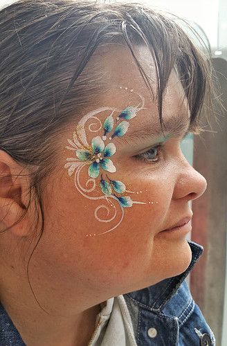 floral Eye Design Floral Face Painting, Floral Face Paint, Flower Face Paint, Market Painting, Face Painting Flowers, Glitter Face Paint, Eye Face Painting, Face Art Painting, Blue Flower Painting