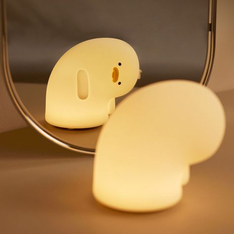 Your perfect night light for kawaii or pastel korean aesthetic room. This silicone rubber melancholy sad duck lamp will bring a touch of cuteness to your desk or bedside table. Best to use as a night light and phone stand. Warm white light, adjustable brightness, automatic 30 minutes sleep timer; Package includes: 1x Night Light Lamp, 1x USB type-c charge cable Dimmable Warm White light 1200 mAh USB Rechargeable Battery works for 4-6 hours 30' Sleep timer Type-C Charging Port (Fully charged for Raccoon Lamp, Pastel Korean Aesthetic, Korean Aesthetic Room, Kawaii Furniture, Kawaii Lamp, Cute Lamps For Bedrooms, Cute Lamps, Duck Lamp, Silicone Lamp