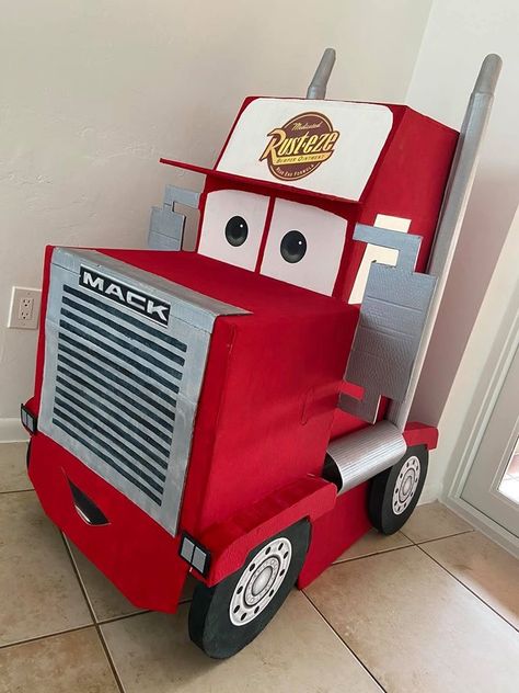 DIY Cardboard Mack from Cars Diy Mcqueen Decorations, Cars Mack Truck Diy, Cardboard Mack Truck, Lightning Mcqueen Cardboard Car, Diy Lightening Mcqueen Box Car, Diy Mack Truck Cardboard, Mack From Cars Cardboard, Monster Truck Cardboard Box Car, Auto Party