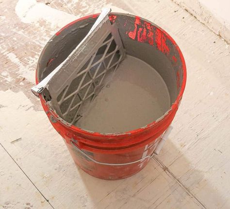 If you're doing a lot of painting, it may make sense for you to purchase your paint in 5 gallon buckets instead. If you do that you can hang a grate in the bucket to roll off excess paint like this. 5 Gallon Buckets, Furniture Painting Tips, Paint Buckets, Paint Tray, Paint Sheen, Learn How To Paint, Interior Painting, Painting Trim, Paint Roller