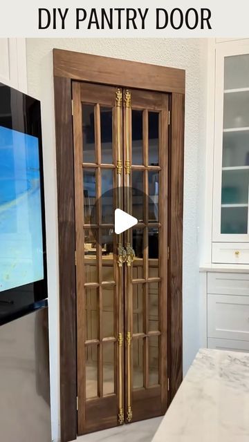 Greg Navage on Instagram: "Like + Comment “link” to receive the supplies list directly to your DM! The Shrimp says I didn’t just build a pantry, I built a statement piece. This door is the exclamation mark ❗️ 🙌  #pantrymakeover #dreampantry #pantrygoals #diyprojects #diyhome #diytutorial #doityourselfproject #diyhomeimprovement #homerenovationideas #doityourself #homereno #kitchentrends #pantryreno #bifolddoors #frenchdoors" Pantry With Folding Doors, Double Door Closet Pantry Ideas, Pantry Accordian Door, Bifold Pantry Doors Kitchens, Mini French Doors For Pantry, Folding Pantry Door Makeover, Blue Pantry Door Ideas, Bifold Door Pantry, Cremone Bolt Pantry Door