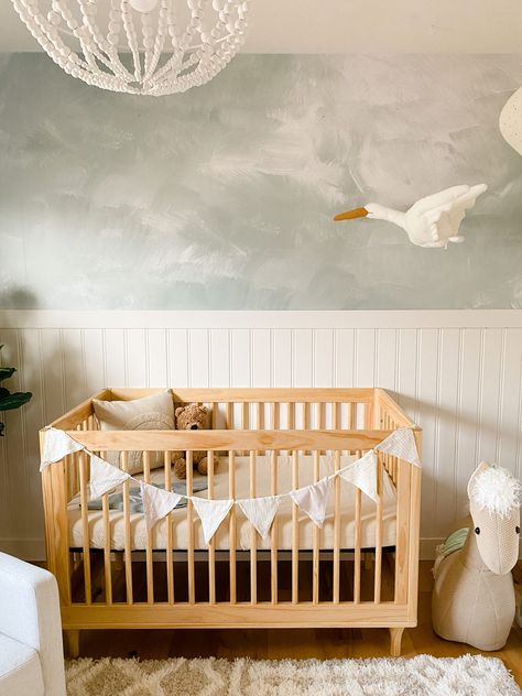 Half Wallpaper Nursery Wall, It Was All A Dream Nursery, Half Wallpaper Nursery, Limewash Baby Nursery, Half Wallpaper Half Paneling Nursery, Baby Boy Room Wallpaper, Gender Neutral Nursery Mural, Baby Boy Wallpaper Nursery, Nursery With Beadboard