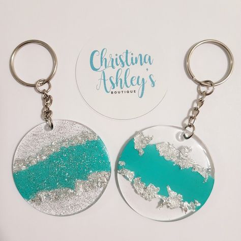 Acrylic Keychain with teal paint, silver foil, and sealed in a clear or glitter resin to keep it glossy ❤ Resin Round Keychain, Glitter Resin Keychain, Circle Key Chain Resin, Black And Silver Resin Keychain, Ocean Resin Keychain, Custom Keychains, Teal Paint, Resin Keychain, Gods Hand