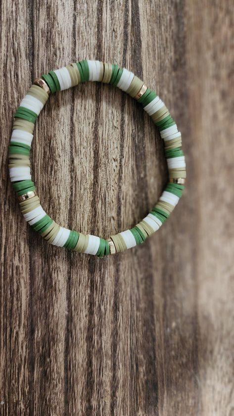 Green Vibes Clay Bead Bracelets Men’s Clay Bracelets, Cute Green Bracelet Ideas, Round Clay Bead Bracelet, Clay Bracelet Aesthetic, Manly Beaded Bracelets, Camo Clay Bead Bracelet, Hawaii Clay Bead Bracelets, Boy Clay Bead Bracelet, Therian Bracelet