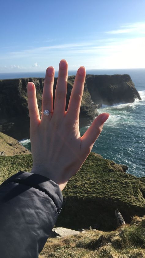 My rose gold, solitaire, halo, brilliant cut engagement ring. Proposal at Cliffs of Moher in Ireland. Engagement Manifestation, Cliff Proposal, Ireland Proposal, Brilliant Cut Engagement Ring, Brilliant Cut Engagement Rings, Ring Proposal, Cliffs Of Moher, Beach Engagement, Galway