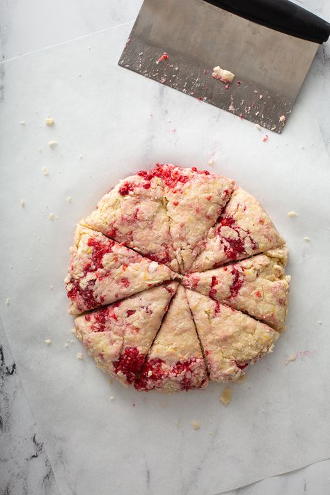 Lemon raspberry scone dough formed into a circle and cut into 8 triangles on a marble surface Sourdough Discard Raspberry Scones, Sourdough Discard Lemon Scones, Sourdough Raspberry Scones, Rasberry Scones, Raspberry Sourdough, Raspberry Lemon Scones, Lemon Raspberry Scones, Raspberry Scones Recipe, Raspberry Scone