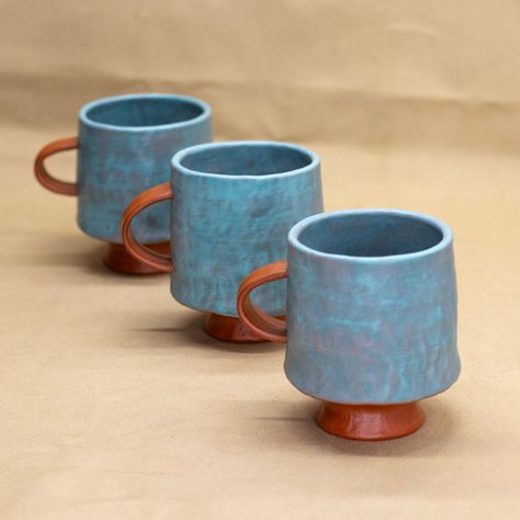 Enjoy your beverage in these handpinched mugs with a pedestal foot. Interior pattern varies. Each sold separately. Microwave and dishwasher safe. Holds approx. 13 oz. Ceramics Mug Ideas, Pottery Handles, Ceramics Mugs, Pottery Inspo, Clay Things, Tanah Liat, Sculpture Ideas, Pottery Handmade, Ceramics Pottery Art