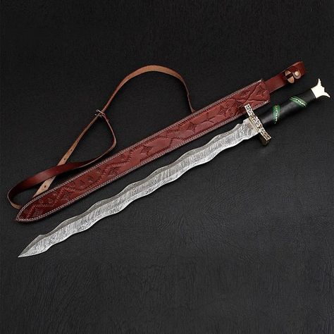 COLLECTIBLE SWORD KRIS BLADE Product Details Materials Damasuc Steel Measurements 38"L x 4.75"W x 1.50"H — Overall Length 38"   — Blade Length: 28"   — Blade Material: 1095 & 15N20 Damascus Steel — Blade Hardness: 56-58 HRC — Handle Material: Pakka Wood, Brass, & Black Micarta — Brass Filework — Fiber Sandwich Guard — Includes Genuine Leather Sheath #sword #knife #art #katana #samurai #swords #medieval #anime #martialarts #warrior #swordartonline #cosplay #axe #knight #knives #shield #hema... Roman Gladius, Viking Mythology, Cool Swords, Steel Art, Anniversary Gifts For Husband, Unique Collectibles, Handmade Modern, Modern Gift, Leather Sheath