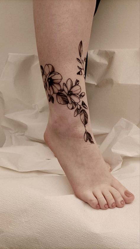 ankle tattoo based on flowers and nature. in this photo you only see part of the ankle Ankle Leaves Tattoo, Large Ankle Tattoo, Ankle Floral Tattoo, Floral Tattoo Coverup, Front Ankle Tattoo, Floral Ankle Tattoo, Front Ankle Tattoos, Ankle Tattoo Cover Up, Tattoos Ankle