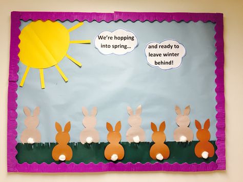 Hopping into spring and ready to leave winter behind. Bunny Bulletin Boards Preschool, Hopping Into Spring Classroom Door, Hopping Into Spring Bulletin Board, Infants Crafts, Preschool Door Decorations, Daycare Bulletin Boards, Spring Classroom Decorations, April Bulletin Boards, Spring Classroom Door