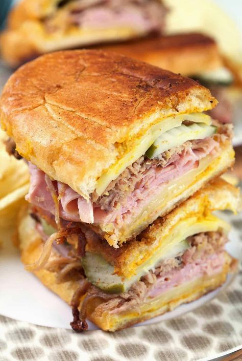 Experience the flavors of a classic Cuban sandwich with succulent roasted pork, savory ham, creamy Swiss cheese, tangy pickles, and zesty mustard, all nestled between slices of perfectly crusty Cuban bread. Best Cuban Sandwich Recipe, Pernil Sandwich, Cuban Sandwich Recipe, Pollo Tropical, Cuban Sliders, Roast Pork Sandwich, Dogs Recipes, Cheese Pickles, Grill Cheese