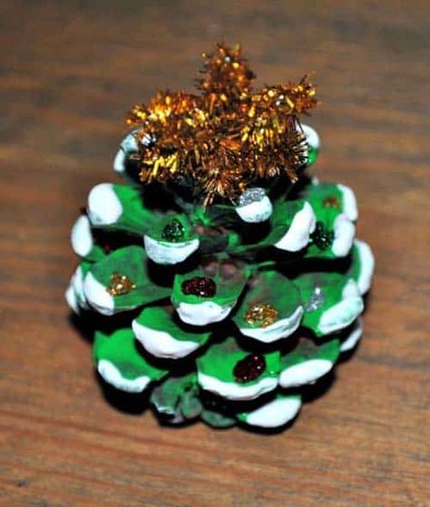 If you need some additional décor for your home, here are 15 easy pinecone crafts for kids to do perfect as Christmas decor! #christmasdecor #christmasdiy Pinecone Ornaments For Kids, Pinecone Crafts For Kids, Pine Cone Crafts For Kids, Pinecone Decorations, Holiday Card Display, Pinecone Crafts Kids, Pinecone Crafts Christmas, Pinecone Crafts, Pine Cone Christmas Tree