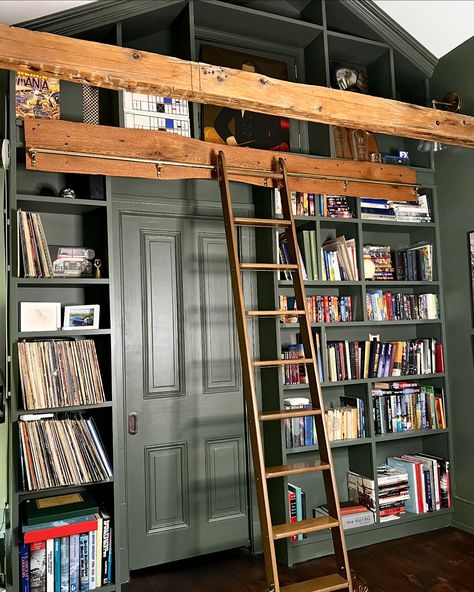 There are stunning brass details on the library ladder we found through an architectural salvage company. The brass roller covers have beautiful curves and the letter P embossed. Each step has a bass rod that runs below it and the hooks on the top of ladder that connect to the brass bar allow the ladder to slide beautifully. We love to find vintage pieces that would have been destroyed or sitting in a cold warehouse if not repurposed. The stories and history that you can dream up behind eac... Library Shelf With Ladder, Antique Library Ladder, Brass Library Ladder, Library Ladder Kitchen, Ladder Art, Library Steps, Wall Nook, Sliding Ladder, Cabin Vibes