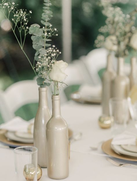 70+ DIY Wedding Decorations With Big-Budget Looks Gold Wine Bottle Centerpiece, Wedding Bottle Decorations, Wine Bottle Centerpiece, Wine Bottle Wedding Centerpieces, Wine Bottle Centerpieces, Wedding Wine Bottles, Gold Wine, Deco Champetre, Bottle Centerpieces