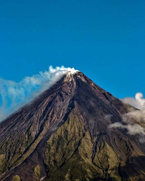 Mt.Mayon or Mayon Volcano is sacred and active stratovolcano which is welknown for it's perfect cone Mayon Volcano Aesthetic, Mayon Volcano Photography, Mt Mayon, Composite Volcano, Volcano Wallpaper, Bicol Region, Philippines Tattoo, Volcano Pictures, Mayon Volcano