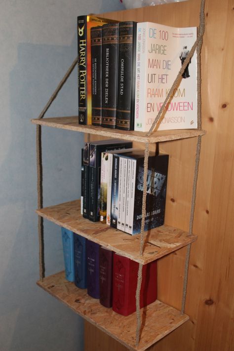 A cheap and easy DIY bookshelf. Fast build. Hangs from anywhere you like. #Hangingbookshelf  #Hanging  #Bookshelf  #Storage  #BookStorage #books #diy #crafts Diy Hanging Bookshelf, Diy Ladder Bookshelf, Easy Diy Bookshelf, Hanging Book Shelf, Diy Bookshelf Ideas, Hanging Bookshelf, Hanging Bookshelves, Books Diy, Diy Bookshelf