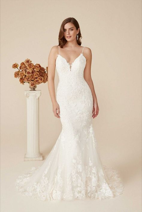 Look absolutely stunning in this fit and flare silhouette, designed with a plunging bikini neckline. Dainty beaded spaghetti straps lead to a low and open V-back, which is the perfect way to add a sexy touch to your wedding day look. The dress is covered in tonal beaded appliqués along with a sparkling glitter tulle underlay for an allover shimmer. A scalloped lace details the hem and while an illusion chapel length train completes this alluring wedding dress. Flare Gown Styles, Justin Alexander Wedding Dresses, Isabella Grace, Wedding Dresses Styles, Justin Alexander Bridal, Beaded Wedding Dresses, Justin Alexander Wedding Dress, Justin Alexander Signature, Sheath Wedding Dress Lace