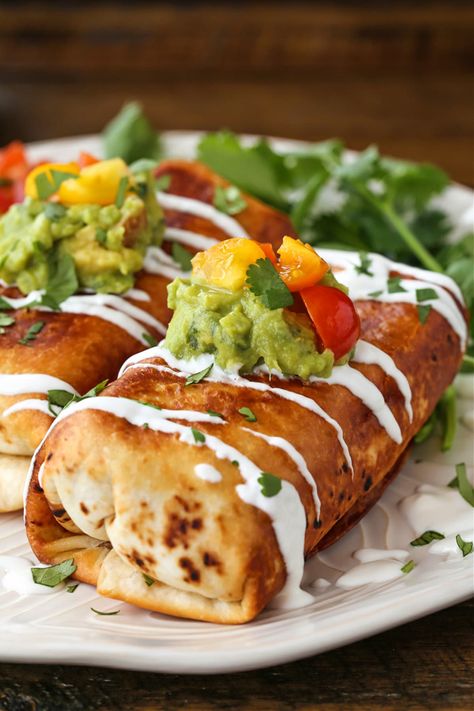 Chicken Chimichangas are perfectly crispy and oozing with flavor! A shredded chicken and cheese filling tucked inside a crispy, pan-fried tortilla. A delicious and fun dinner with a Mexican vibe! #chimichangas #burritos #chickenrecipes Chimichanga Recipe Chicken, Chimichangas Recipes, Burrito Ideas, Chicken Chimichanga Recipe, Texmex Recipes, Mexican Cornbread Recipe, Chicken Chimichanga, Mexican Cantina, Chicken Chimichangas