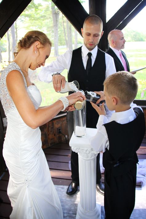 Unity sand ceremony Unifying Ceremony Ideas, Unity Sand Ideas, Blended Family Sand Ceremony, Vow Renewal Reception, Flower Arrangements For Church, Sand Ideas, Wedding Ceremony Unity Candle, Family Wedding Pictures, Country Outdoor Wedding