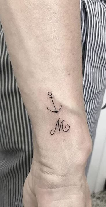 150 Anchor Tattoos | A Deep Dive into Symbolism and Style - Tattoo Me Now Nautical Themed Tattoos, Navy Anchor Tattoos, Anchor Flower Tattoo, Traditional Anchor Tattoo, Anchor Tattoo Wrist, Small Anchor Tattoos, Rope Tattoo, Small Anchor, Anchor Tattoo Design