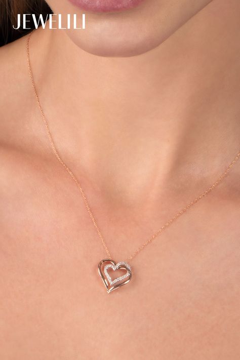 Bring your emotions alive with this Double Heart Pendant Necklace. Crafted in 10K rose gold, it features a grand design of two interlocking hearts. The necklace boasts sparkling white diamonds along the heart shapes, creating a radiant look. This necklace makes a perfect gift for a loved one, symbolizing the intertwined nature of love and affection. Its timeless style will instantly bring a smile to your Mom's face this Mother's Day. Chain Clothing, Interlocking Hearts, Cubic Zirconia Necklace, Grand Designs, Heart Pendant Diamond, Double Heart, Diamond Heart, Heart Pendant Necklace, White Diamonds