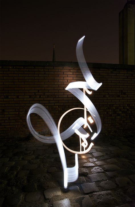 Light Calligraphy by Julien Breton Light Calligraphy, Indian Hotel, Ramadan Calligraphy, Arabic Calligraphy Fonts, Chandelier Art, Calligraphy Artwork, Islamic Caligraphy, Caligraphy Art, Art Light