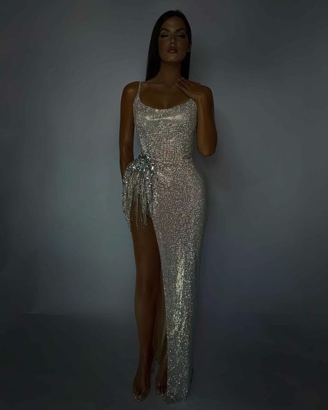 For orders DM us . Feel free to send us a direct message to place your order. Elevate your evening with our exquisite strapless gown, a harmonious fusion of sophistication and allure. This stunning creation is meticulously adorned with intricate beadwork and handcrafted crystals, radiating an aura of timeless elegance and charm that captivates the senses and mesmerizes the onlookers. Crafted with meticulous attention to detail, the gown boasts a flawless silhouette that gracefully accentuate... Luxury Strapless Dress With Crystal Embellishments, Luxury Rhinestone Strapless Evening Dress, Luxury Silver Strapless Evening Dress, Luxury Strapless Glamorous Sequin Dress, Luxury Silver Sequin Dress With Crystal Embellishments, Strapless Gown, Feel Free, Dress Making, Custom Made