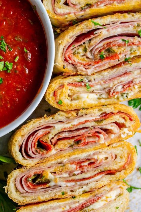 Classic Stromboli Recipe (Easy Dinner or Quick Appetizer!) from The Food Charlatan. This easy stromboli recipe is basically rolled up pizza. The classic ingredients include mozzarella, ham, and salami. It's so good dipped in marinara! A perfect quick dinner (that kids love) or appetizer for football-watching. It's simple to learn how to make stromboli! #stromboli #pizza #easy #pepperoni #italian #homemade #fast #quick #marinara #dough Cinnamon Stromboli Pizza Inn, Stromboli Video Recipe, Ruben Stromboli, Italian Calzone Recipe, The Food Charlatan Recipes, Stromboli Filling Ideas, Stromboli Roll, Stromboli Pizza, Easy Stromboli