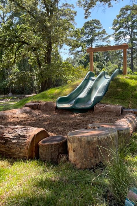 A double hill-slide on a natural playground. In Ground Slide On Hill, Hill Slide Diy, Slide In Hill Backyard, Diy Natural Playground Ideas, Log Playground Ideas, Nature Playground Backyard, Slide In Hill, Nature Playground Ideas, Diy Hill Slide