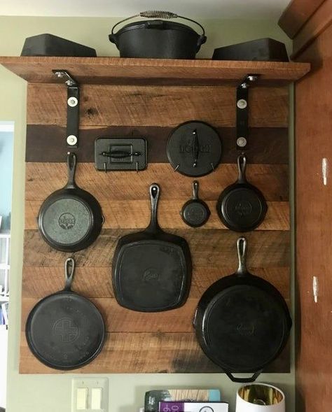 Cast Iron Skillet Hanger, Cast Iron Wall Display Ideas, Shelf Over Refrigerator, Cast Iron Cookware Display, Skillet Wall, Rustic Pot Racks, Small Log Cabin Plans, Pan Wall, Cast Iron Decor