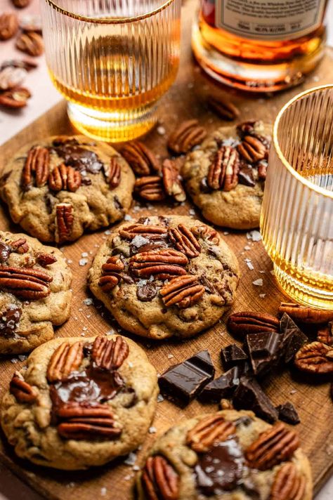 These easy, soft, and gooey bourbon pecan chocolate chip cookies start with bourbon-soaked pecans and are mixed with loads of chocolate chips and the perfect cookie dough! If you love bourbon and chocolate, these are the PERFECT cookies for you! Chocolate Bourbon Cookies, Whiskey Chocolate Chip Cookies, Baking With Bourbon, Maple Bourbon Cookies, Bourbon Pecan Chocolate Chip Cookies, Bourbon Chocolate Chip Cookies, Brown Butter Bourbon Pecan Cookies, Liquor Cookies, Bourbon Treats